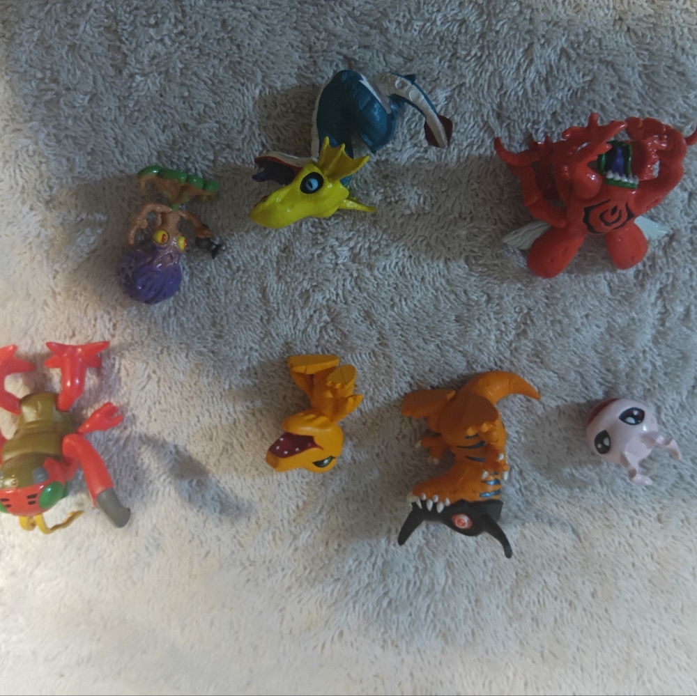 Lot of 7 Vintage Bandai Digimon PVC MinifiguresA collection of seven vintage L